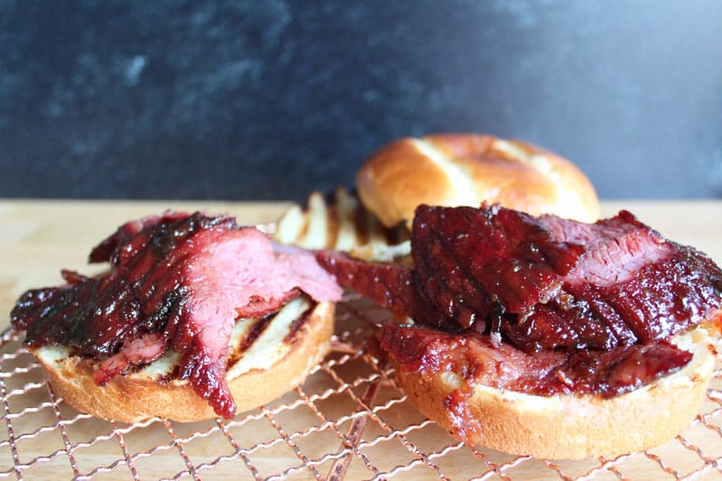 two sandwiches on top of a grill
