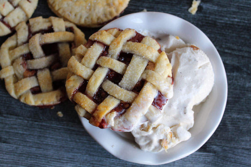 A mini hand pie on top of a bowl of ice cream