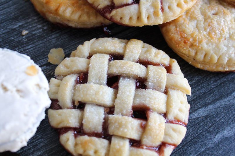 A close up of a lattice top pb&j hand pie